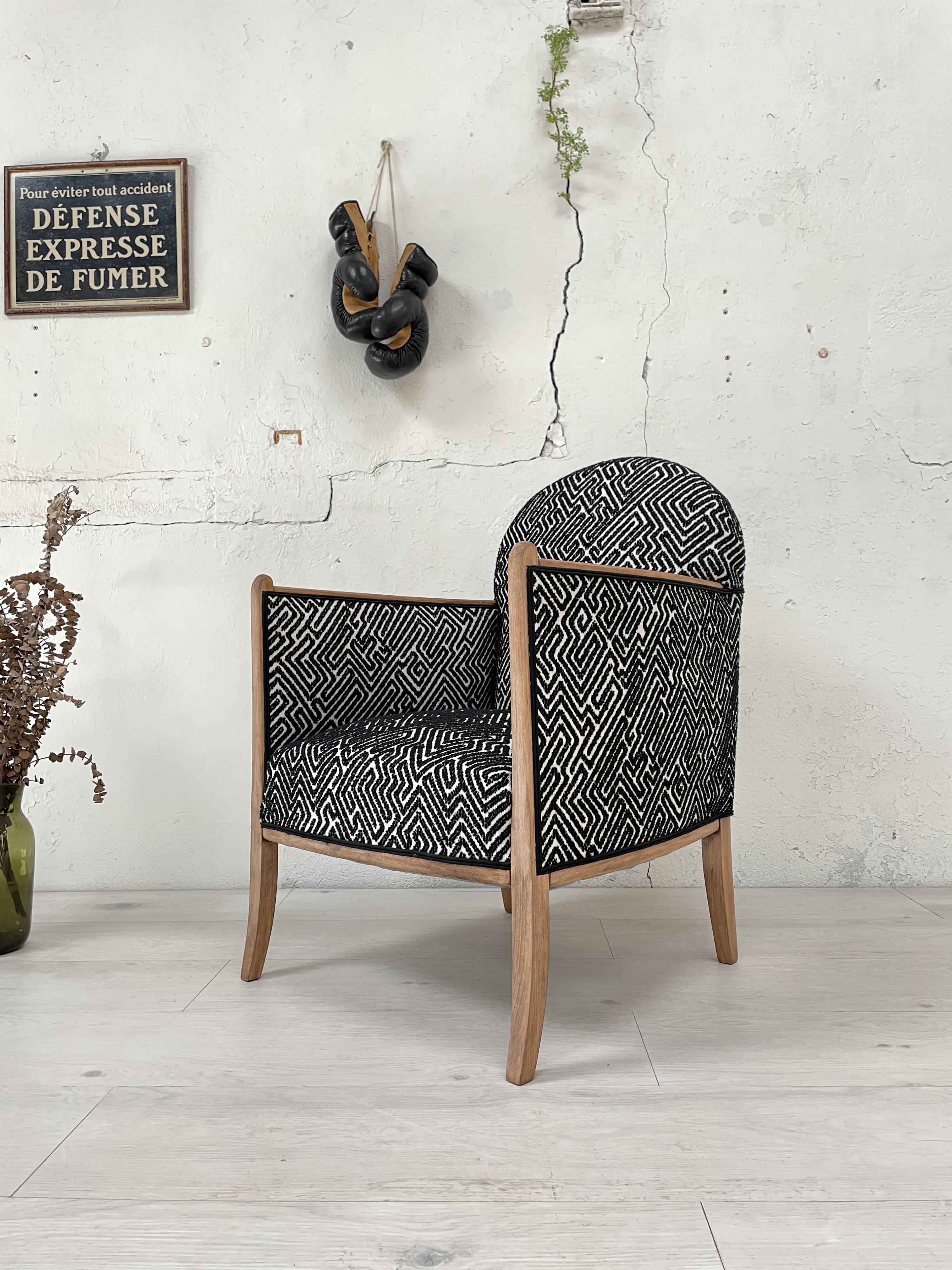 Club armchair in wood and fabric.