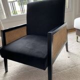 Fauteuil en velours noir et cannage