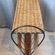 Antique magazine rack made of iron and woven rattan wicker