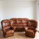 Living room set: 3-seater sofa and 2 brown leather armchairs.