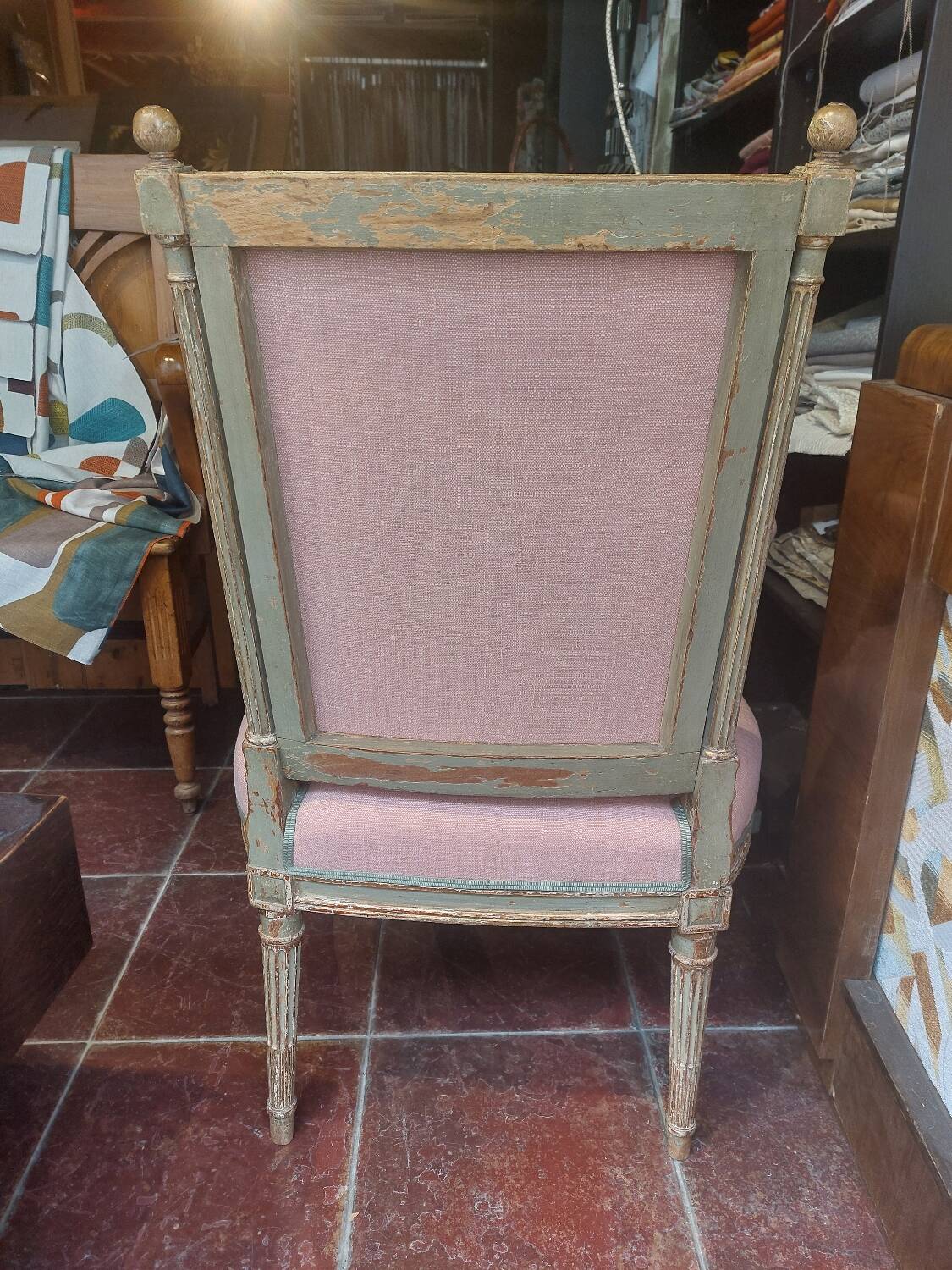 Patinated Louis XVI style armchair