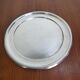Round silver-plated metal tray from the mid-20th century