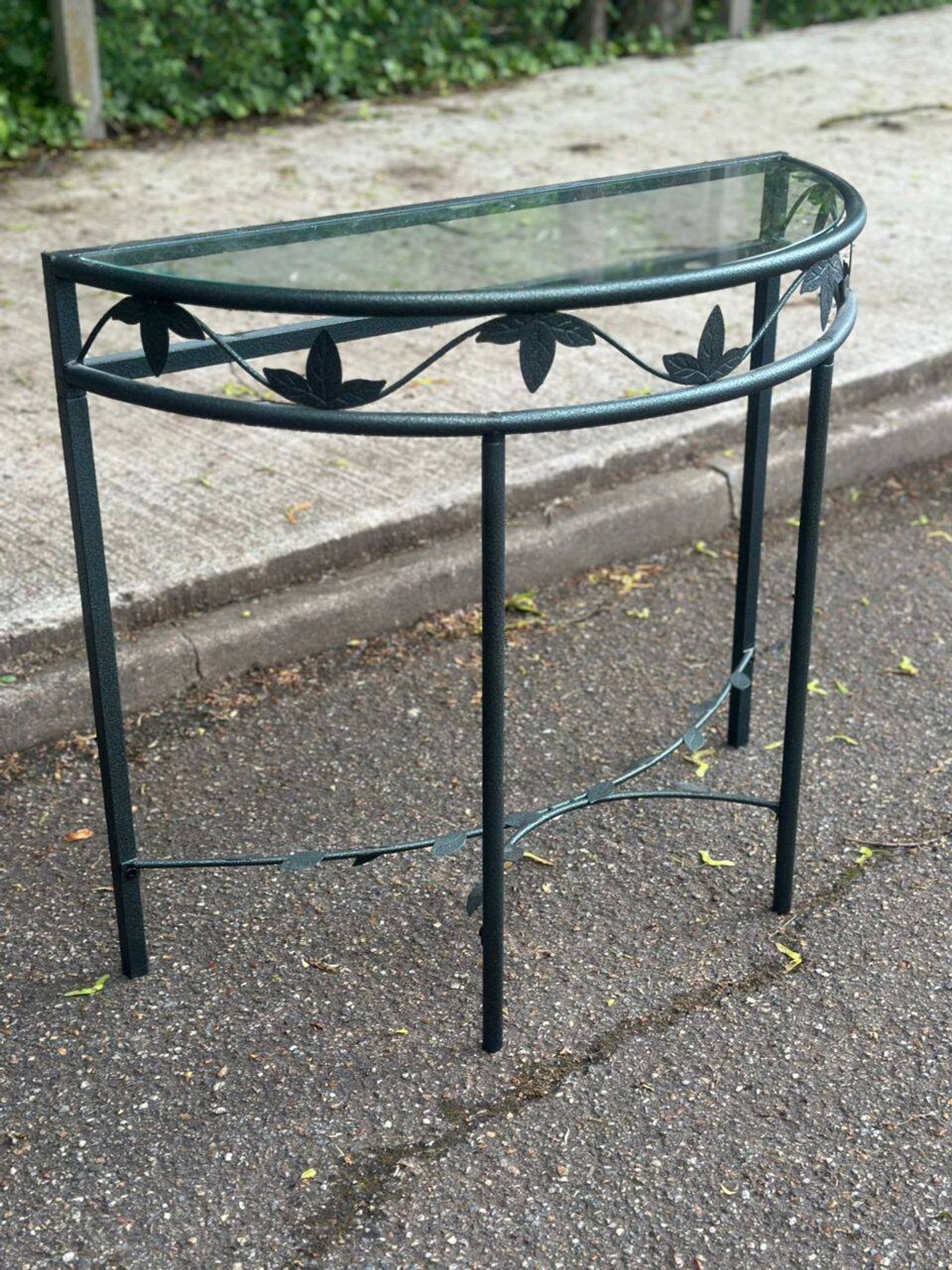 Grey-green wrought iron half-moon console with glass, 85cm.