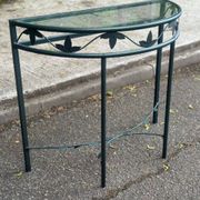 Grey-green wrought iron half-moon console with glass, 85cm.