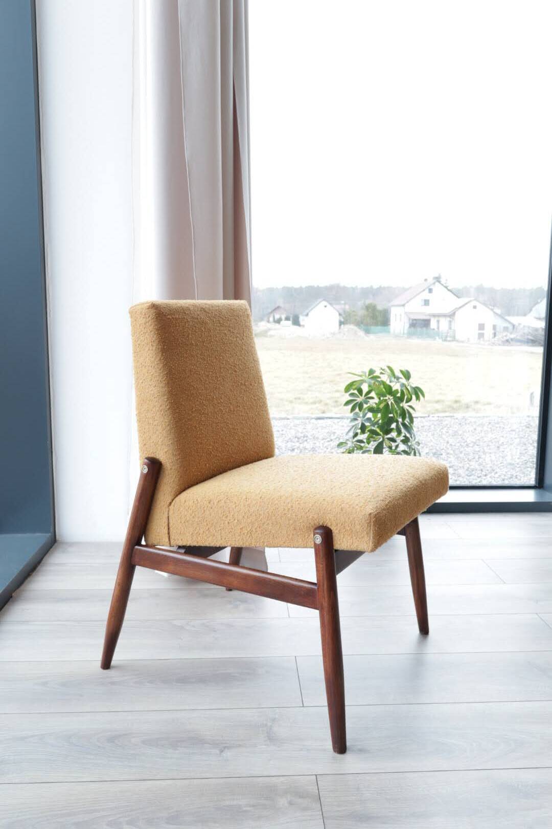 Yellow vintage lounge chair armrests boucle upholstery, walnut wood, Scandi