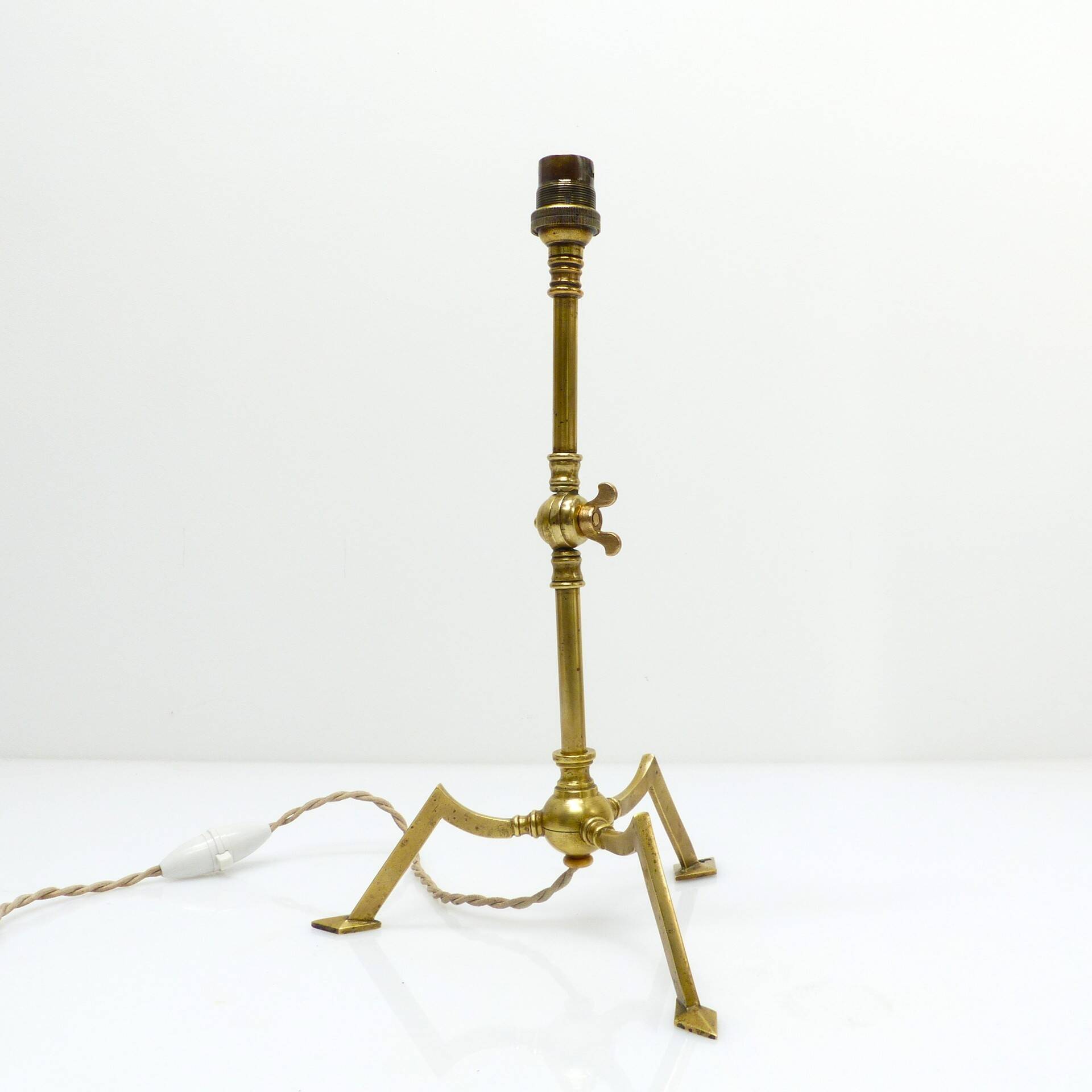 Articulated tripod lamp base in brass, Arts & Crafts style, in the manner of.