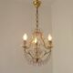 French gilt bronze three-light cage chandelier with pink and clear beaded swags.