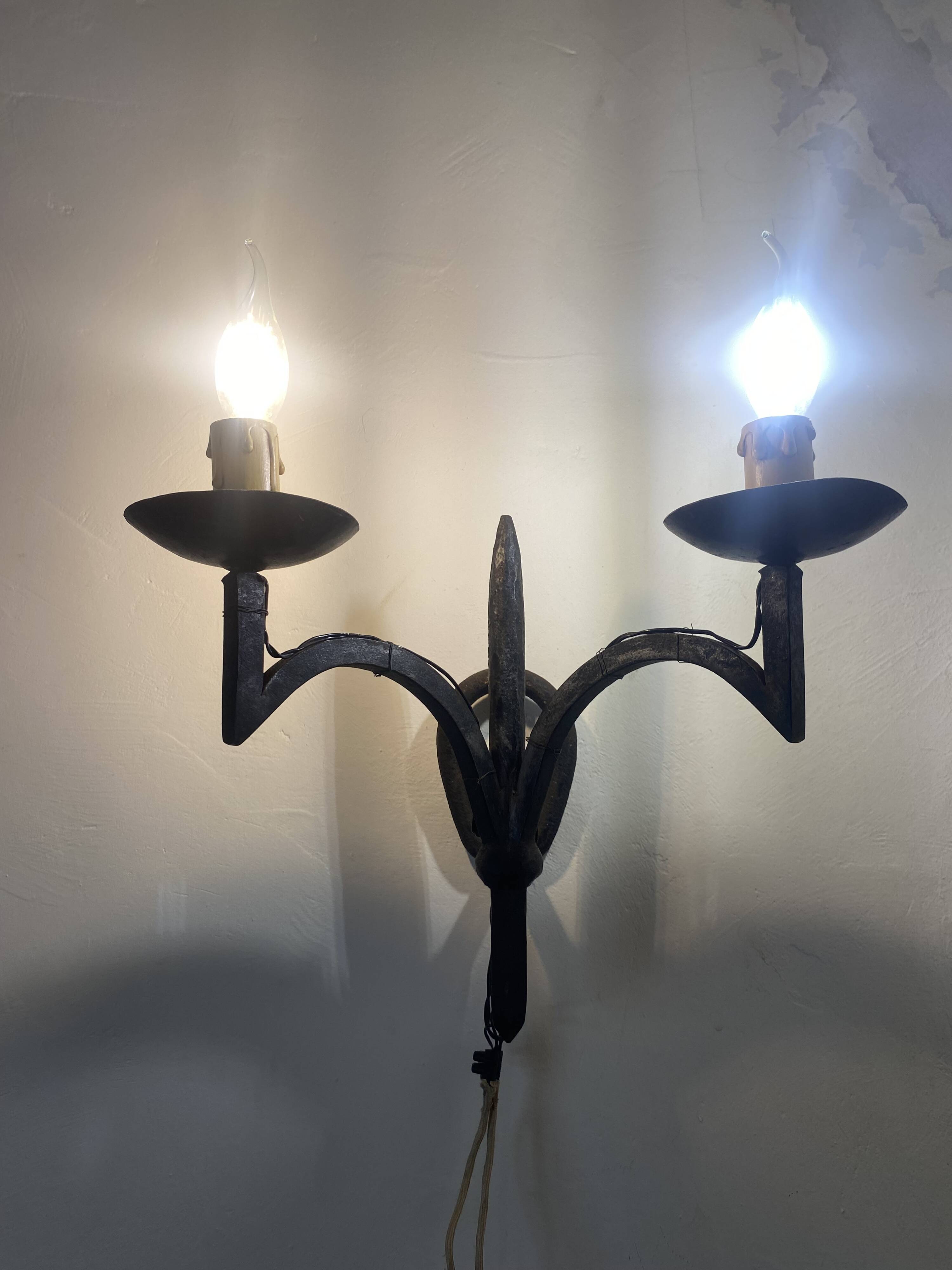 Wrought iron wall lights.