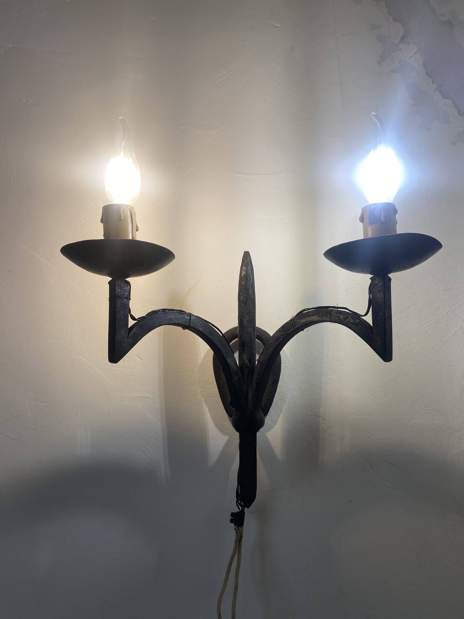 Wrought iron wall lights.