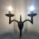Wrought iron wall lights.