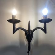 Wrought iron wall lights.