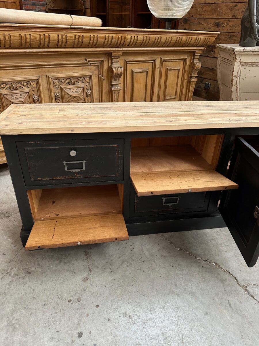Old workshop furniture transformed into a TV unit.