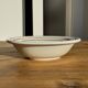 Small earthenware bowl from Italy, white with brown, green, and orange trim, D24.5.