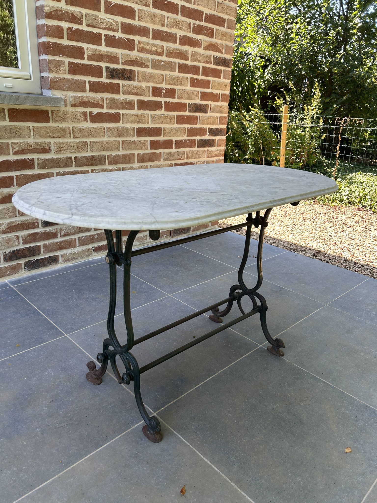 Art Nouveau cast iron and marble bistro table.
