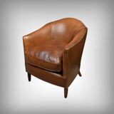 Solange club armchair in sheepskin leather.