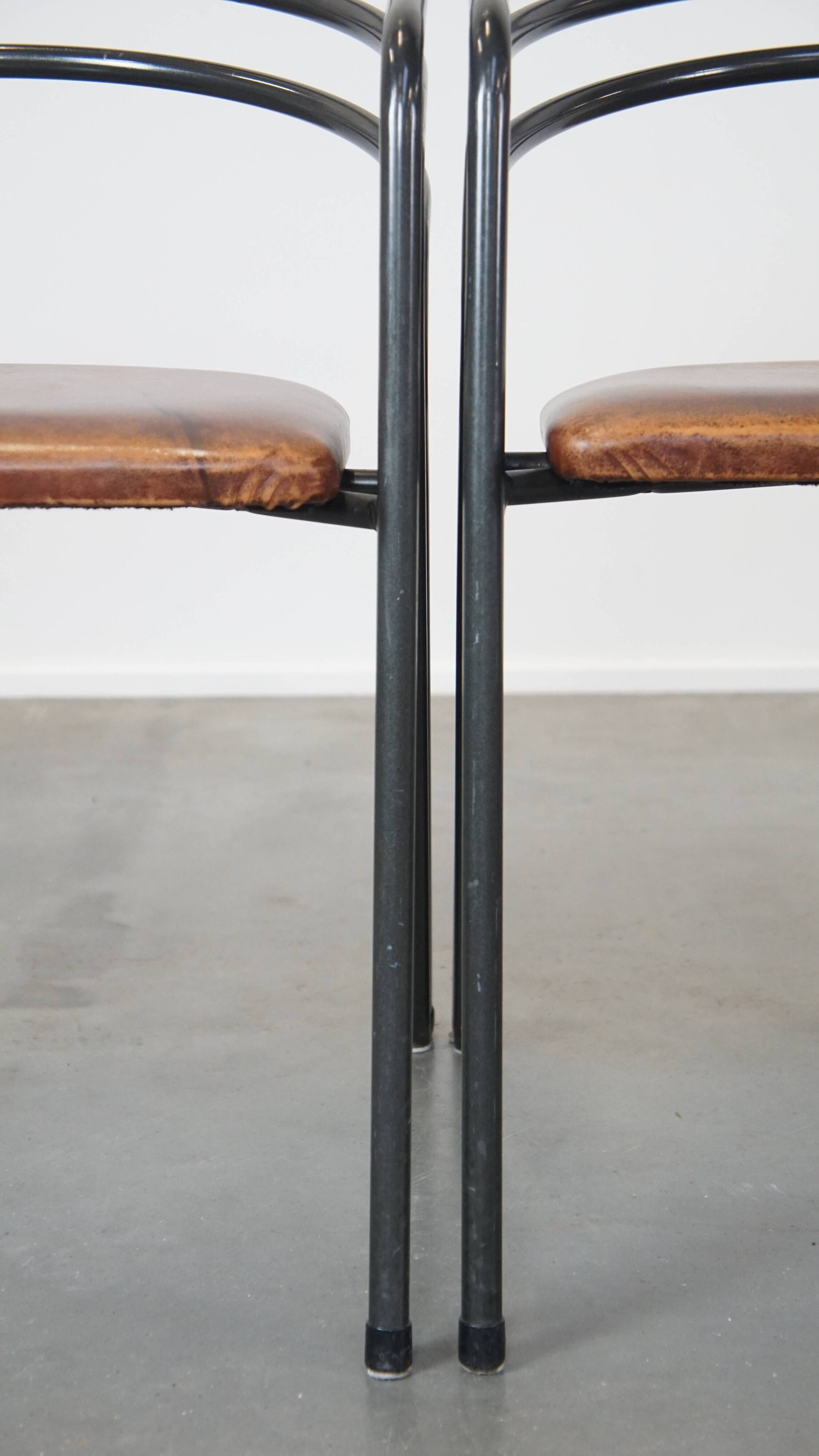 Set of 4 1970s design dining chairs with leather seats and metal frame