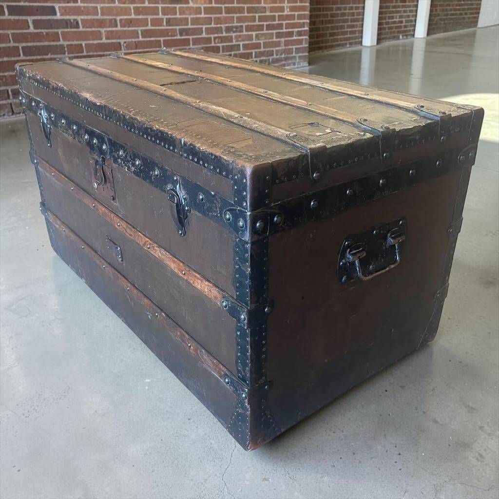 Vintage wooden coffee table with iron fittings.