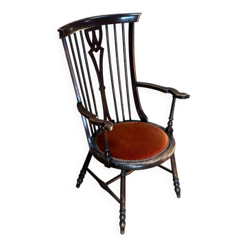 Windsor chair with comb back, stained wood and terracotta velvet.