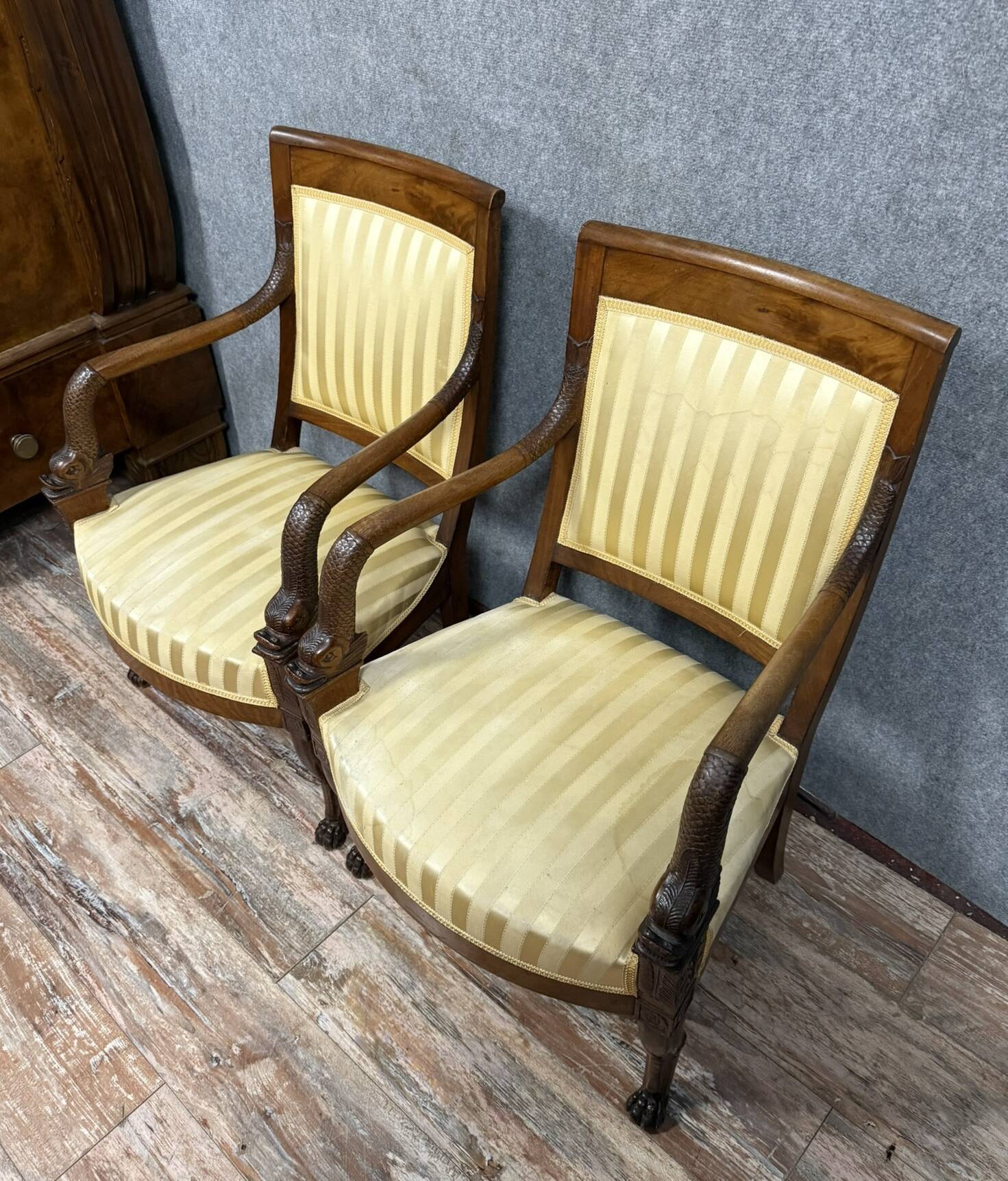 Pair of Empire period mahogany dolphin armchairs