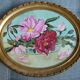 Pair of stucco frames and oil bouquets
