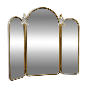 Vintage triptych mirror in brass with wall lights.