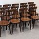 Set of 13 Baumann bistro chairs in bent beech, France circa 1930.