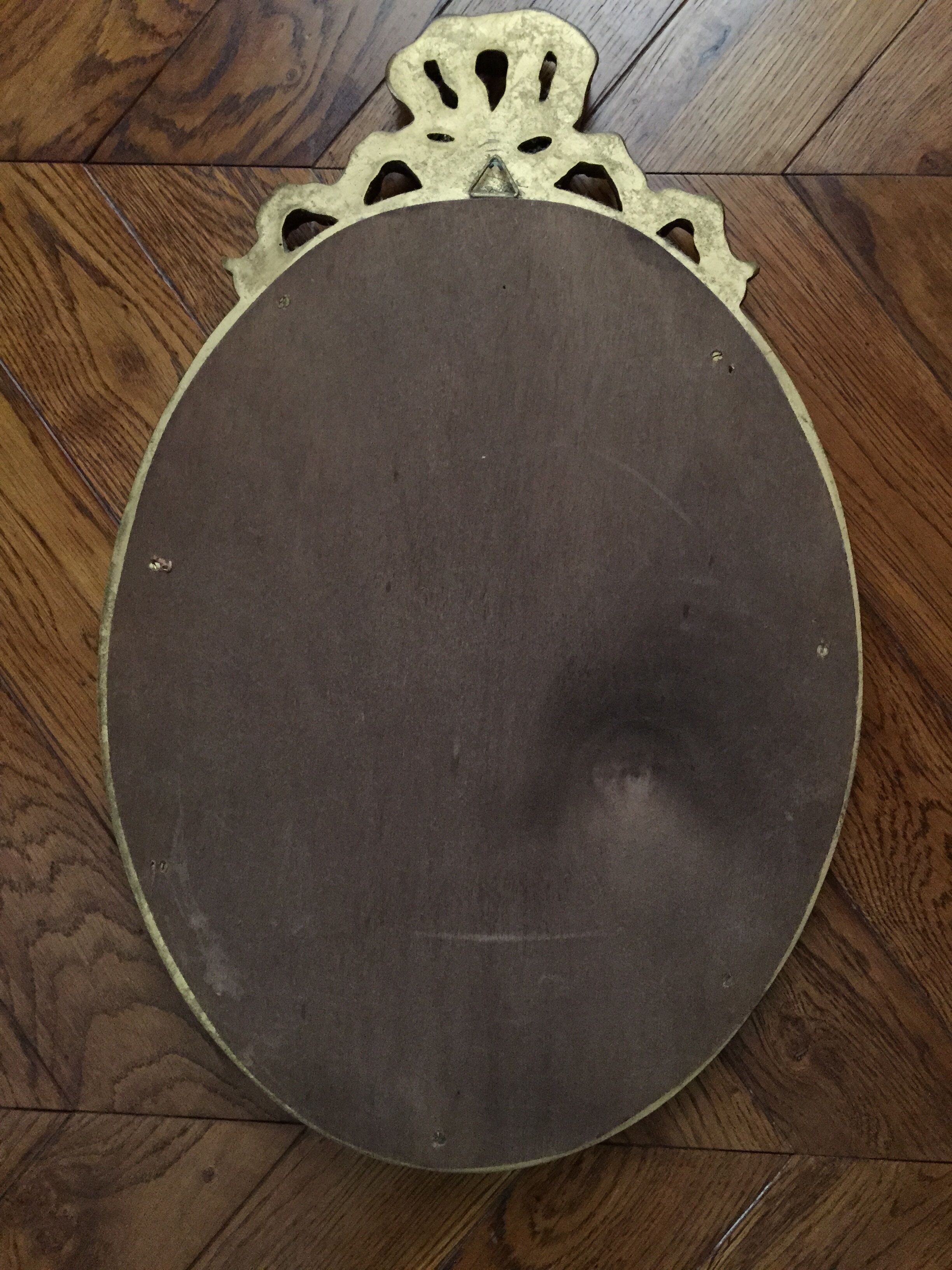 Miroir ovale en bois doré 52 x 35 cm
