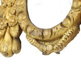 Petit miroir ancien patiné en bois doré du XIXe siècle