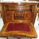 Important Louis XV secretary, in floral marquetry and rich.