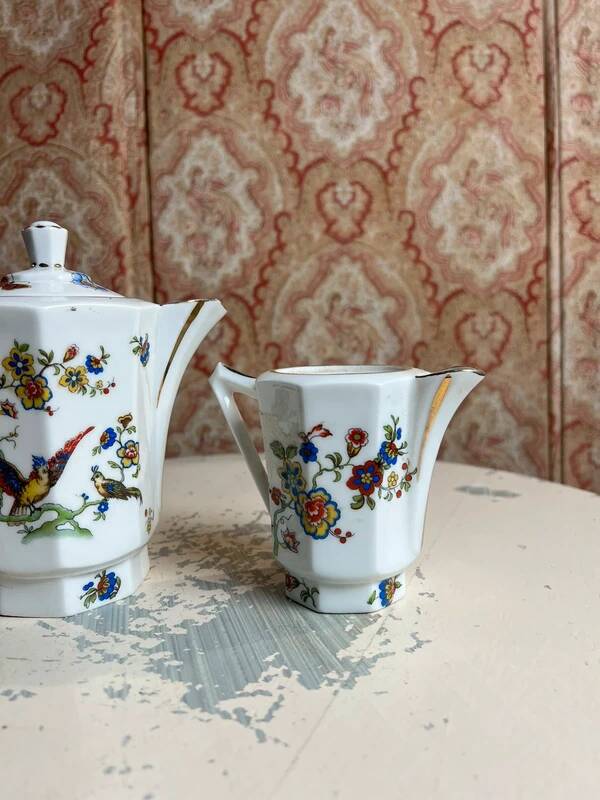 Limoges porcelain teapot/coffee pot and milk jug decorated with peacocks