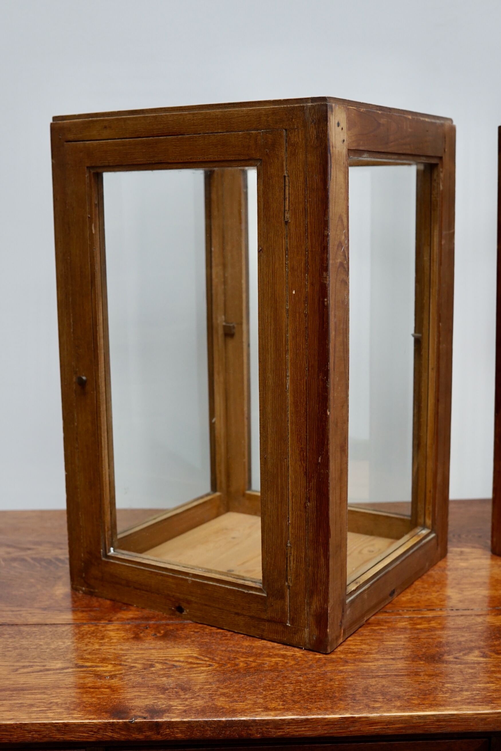 pair of faux oak shop display cabinets, circa 1920s
