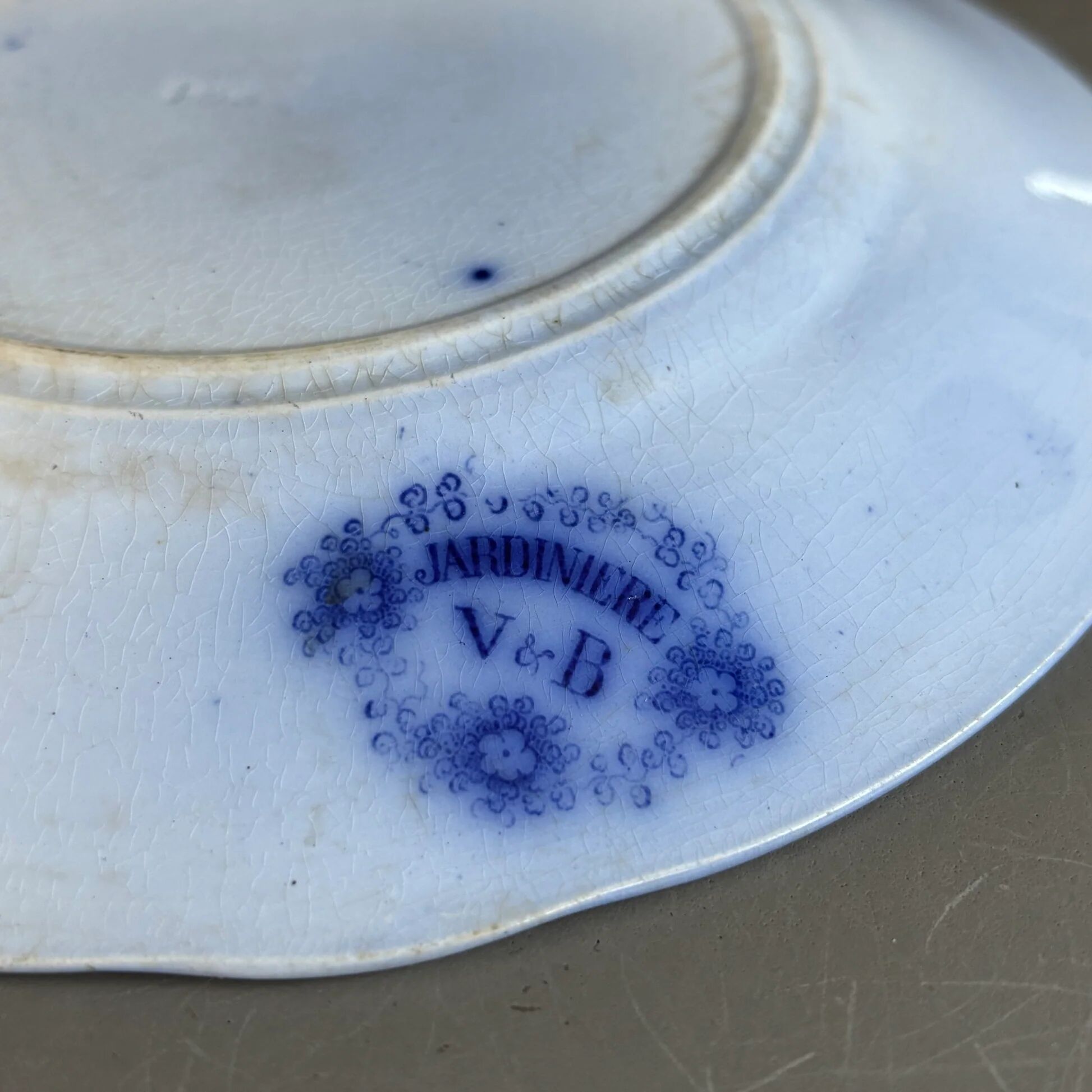 Stack of Sarreguemines plates, jardinière model.