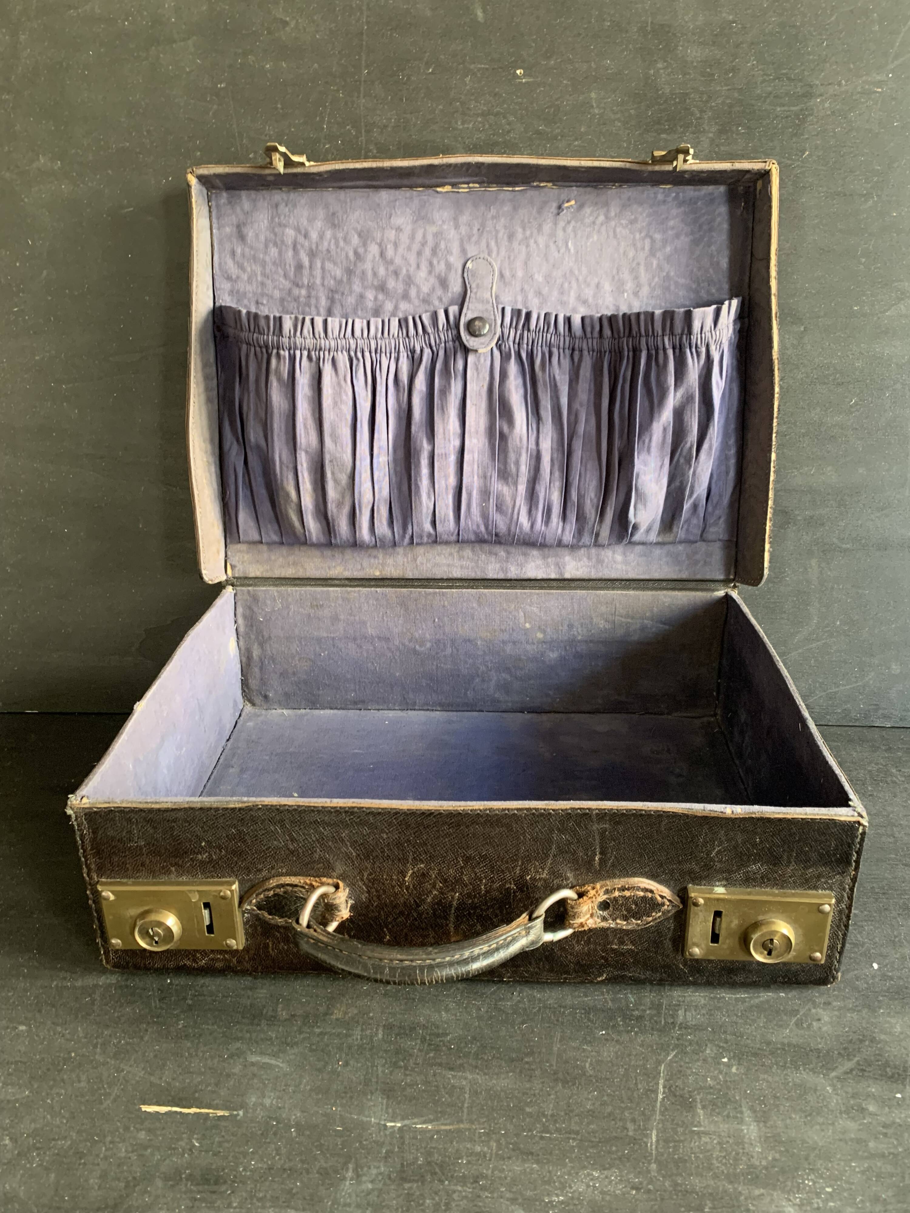 Small black grained leather travel suitcase from the 1920s