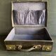Small black grained leather travel suitcase from the 1920s
