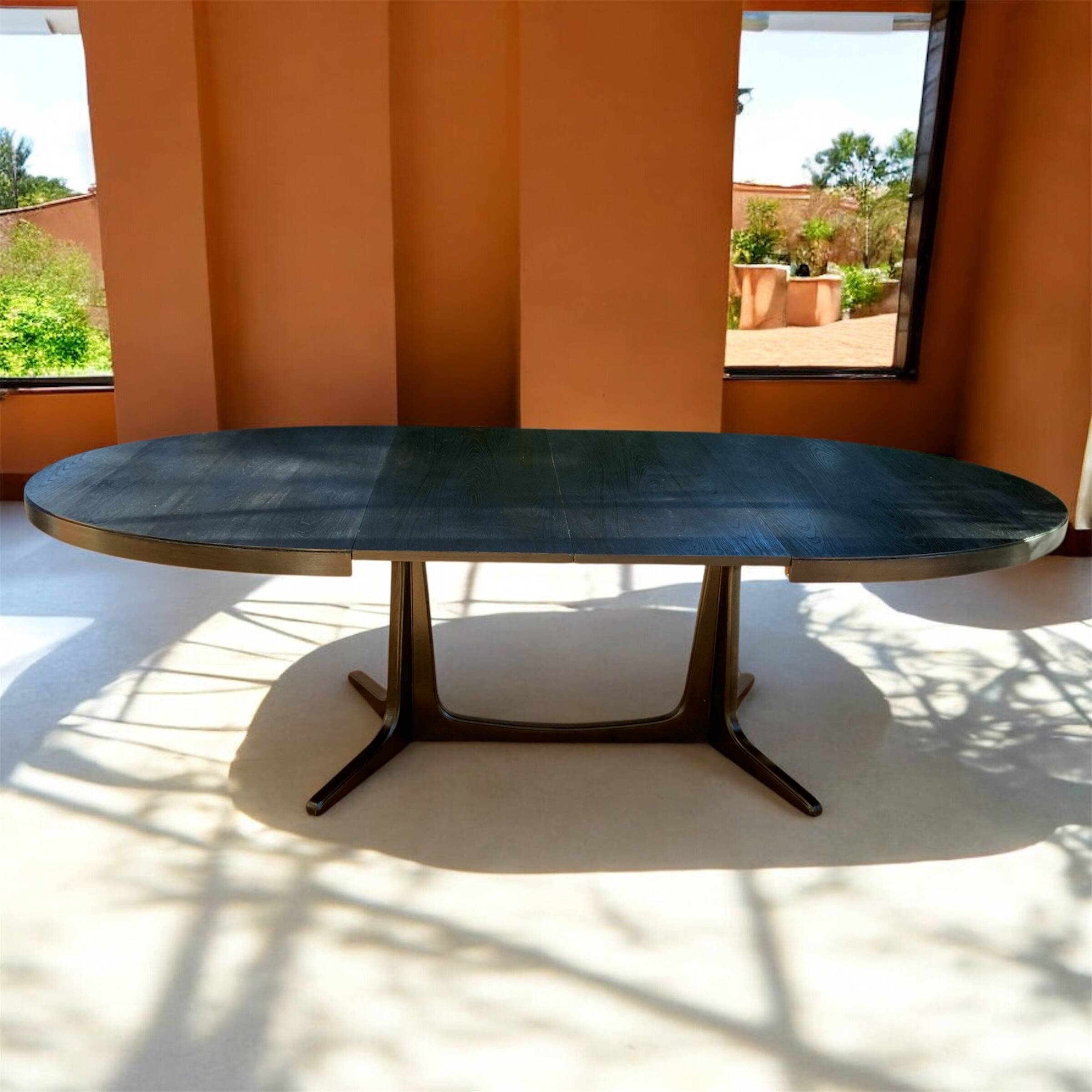 Oval extendable dining table in the style of baumann — ebonised black — vi