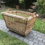 Rattan laundry basket on vintage wheels