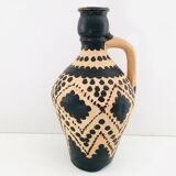 Raw and black terracotta jug