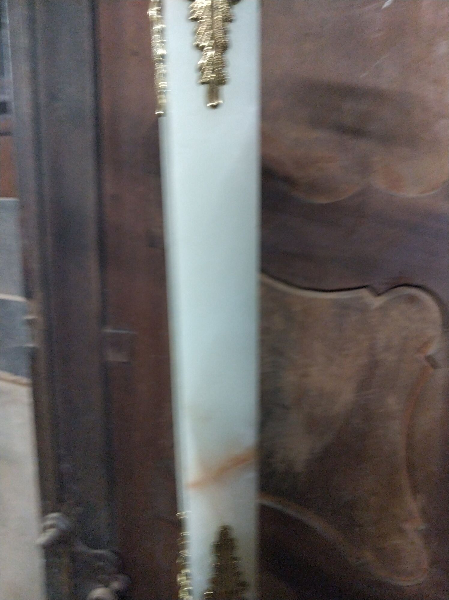 Coat holder on onyx and gold metal foot