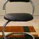 Cobra chairs in steel and black leather by Giotto Stoppino, 1970s, set of 5.