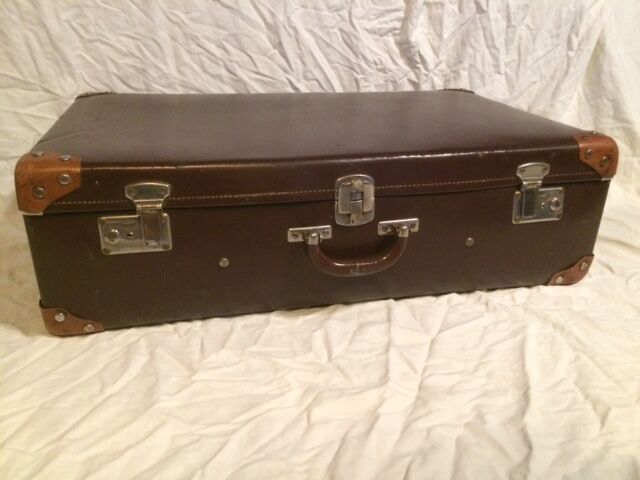 Suitcase vintage leather inside and brown carpeted home