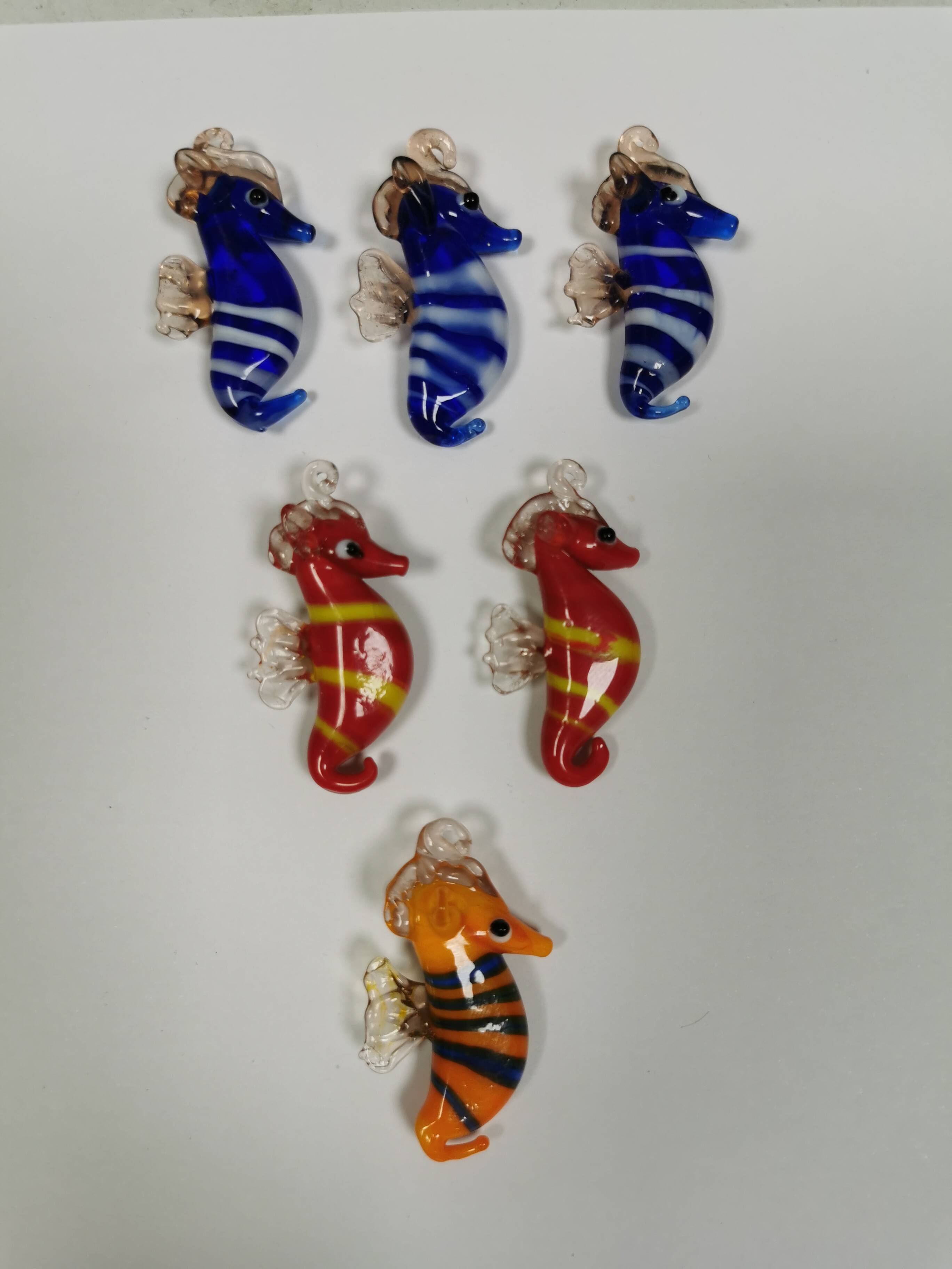 Six small Murano Seahorses in glass.