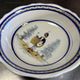 Large centrepiece table dish in earthenware with a painted decoration of a drummer.