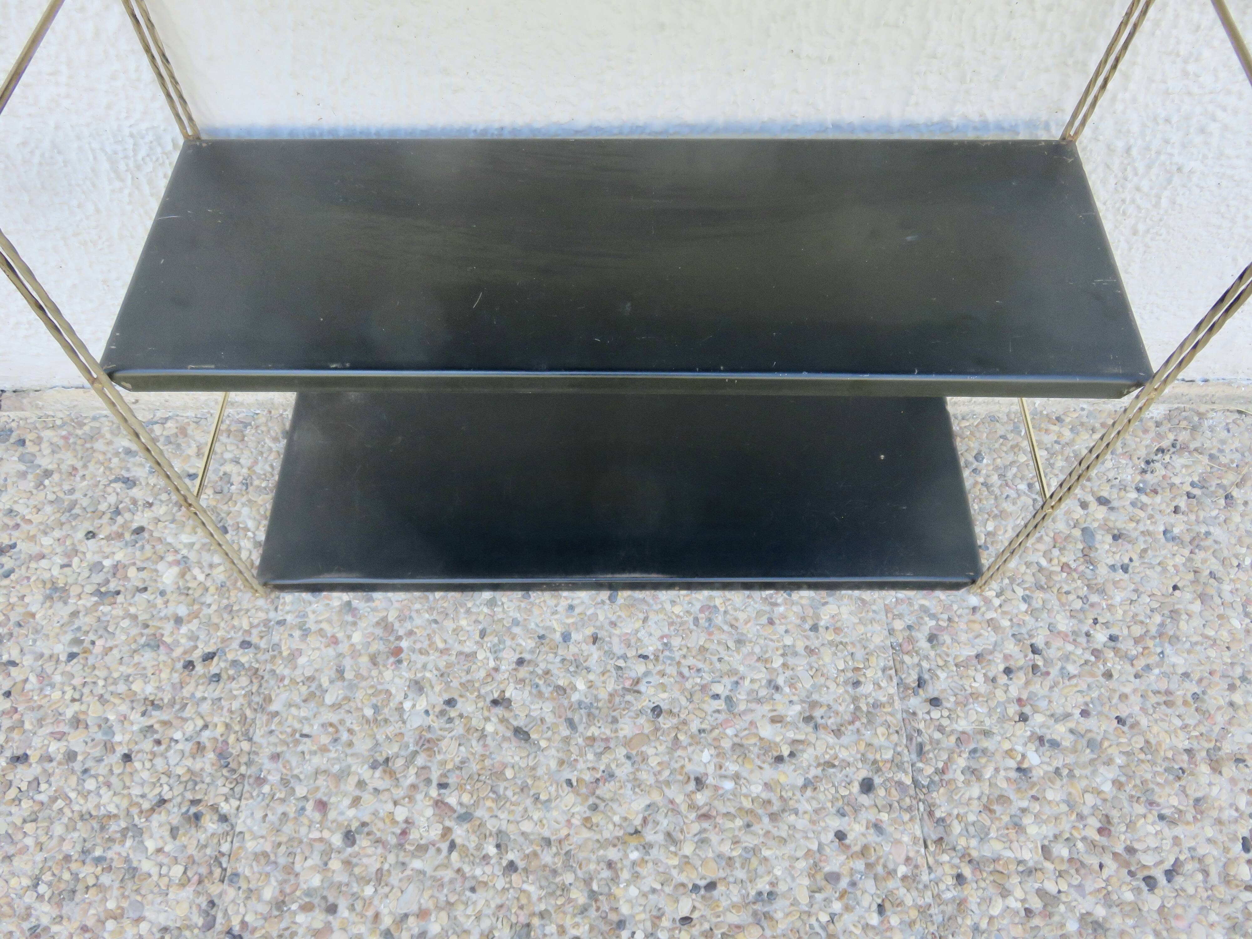 Modular String shelf in gold and black metal