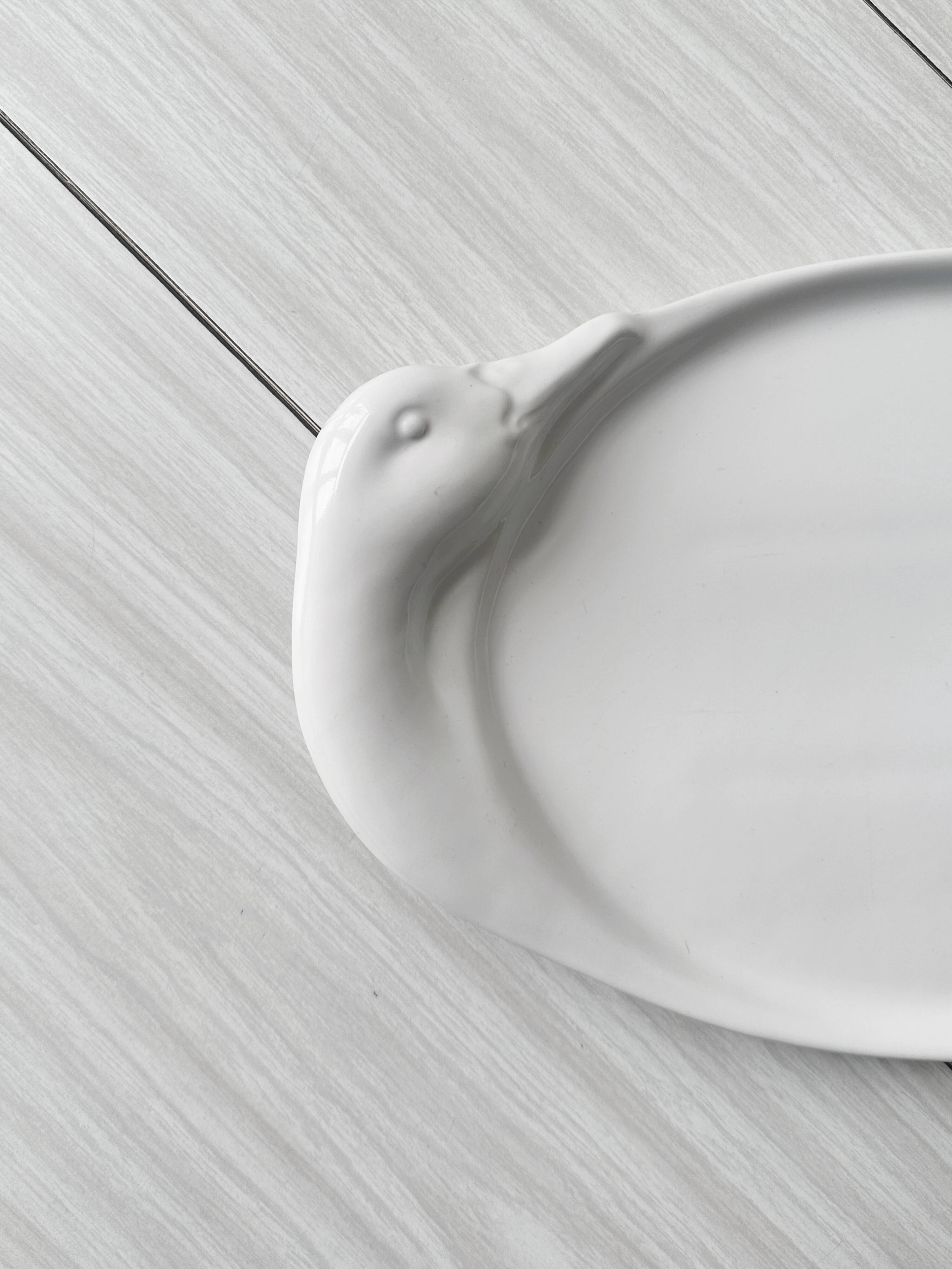 Porcelain goose serving dish.