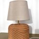Oval table lamp in handcrafted ceramic with draped effect.