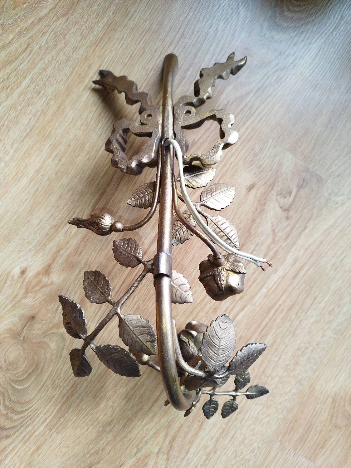 Bronze and gilded metal wall sconce in Louis XVI style.