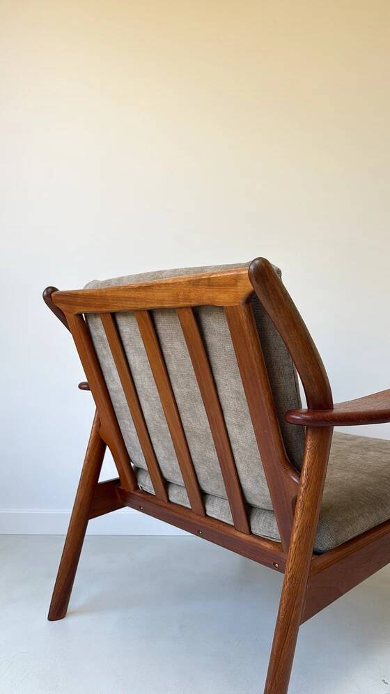 Vintage teak wooden armchair