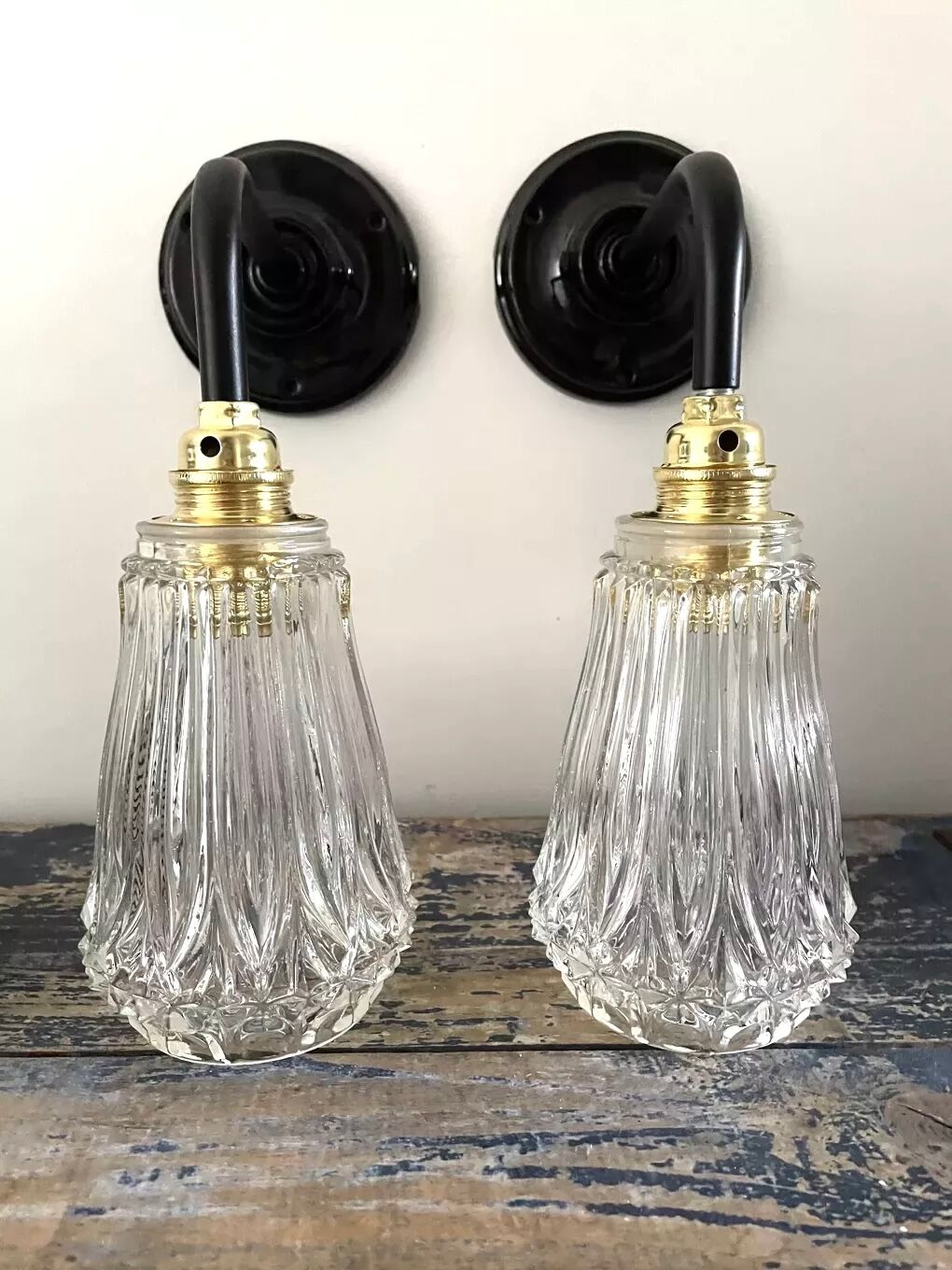 Set of two electrified chiseled glass sconces to nine