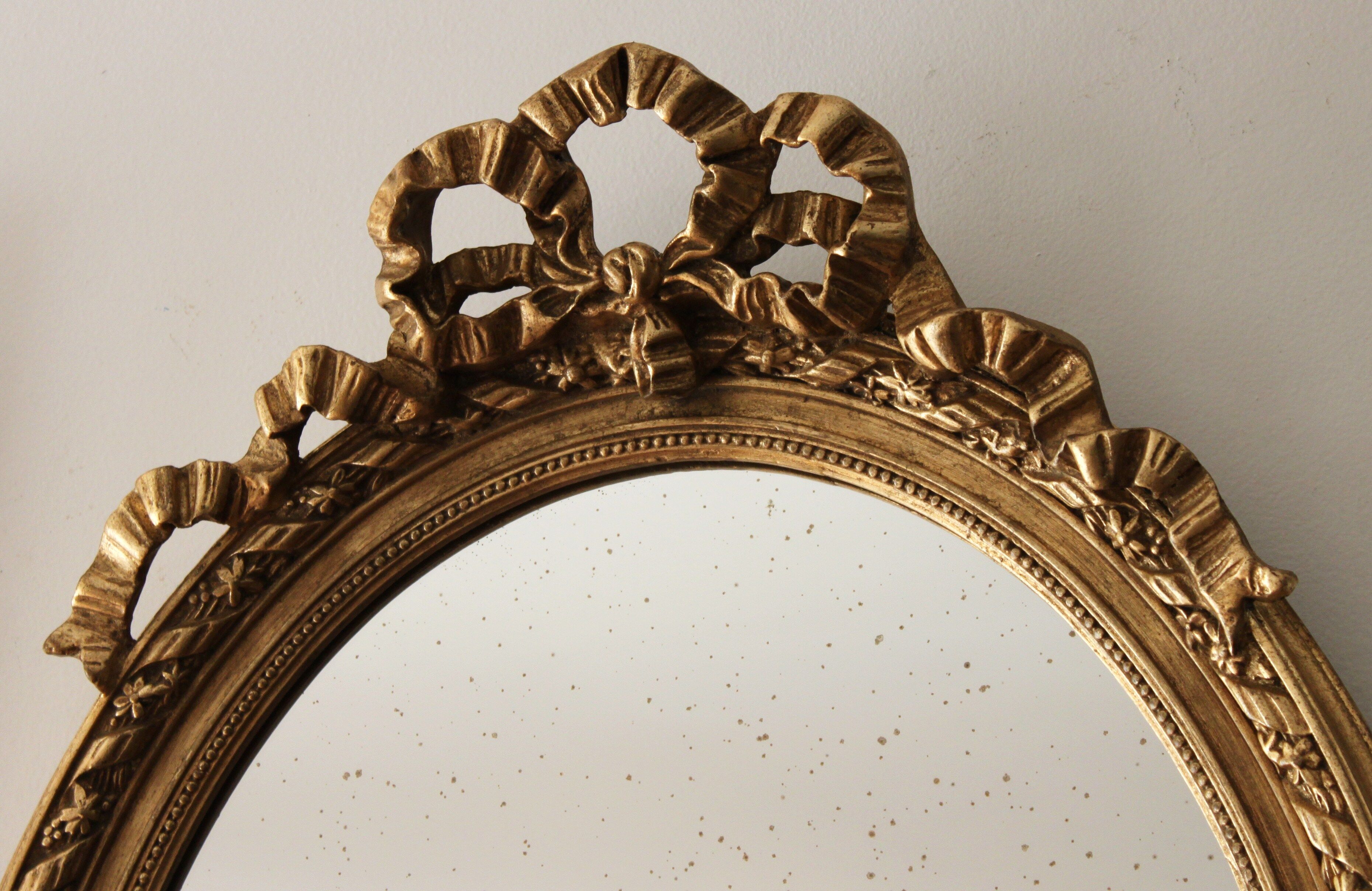 Mirror oval, golden Louis XVI style