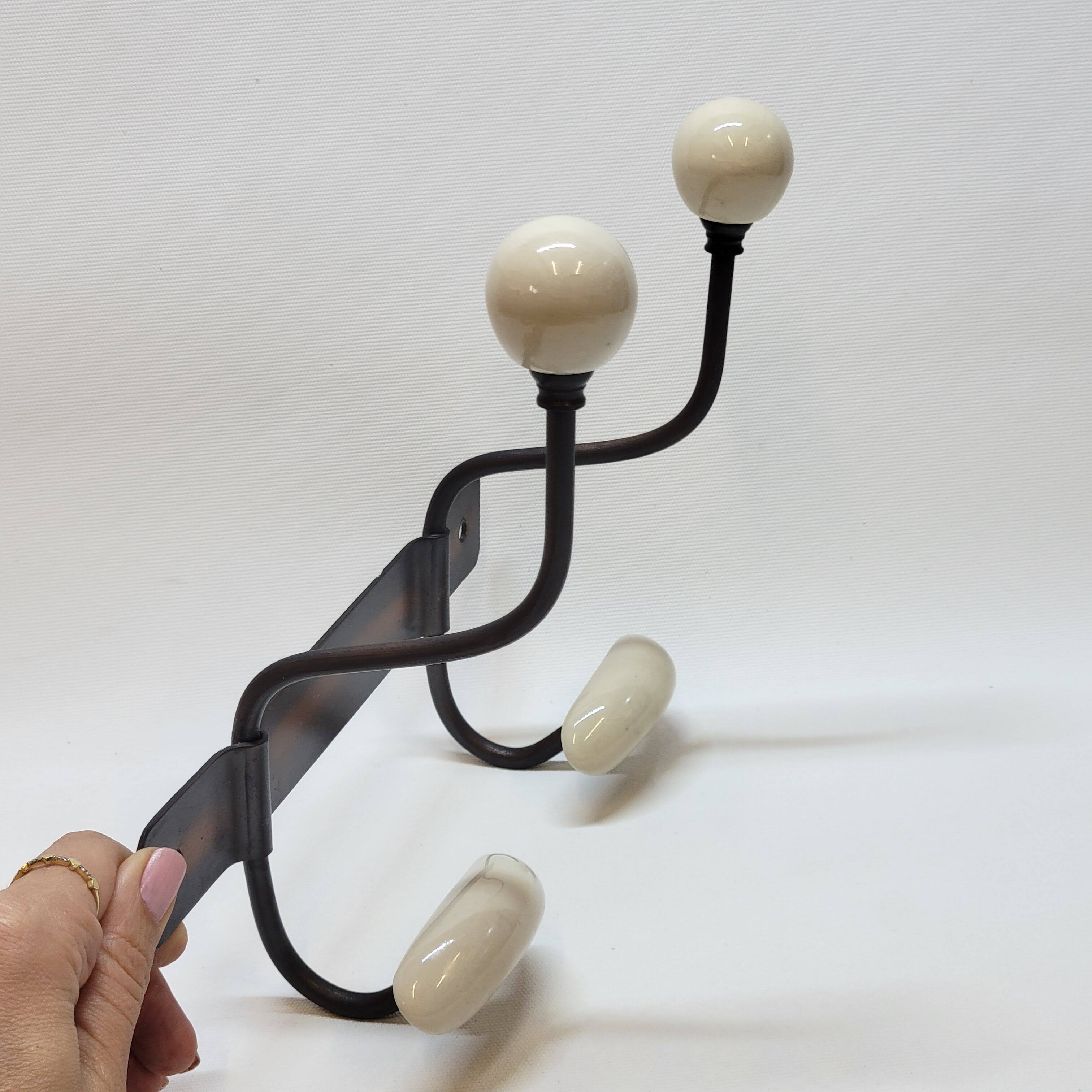 Wall coat rack in metal and porcelain with 2 hooks